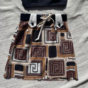 Vintage MOD print mini skirt with patent leather belt